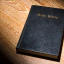 A Bible laying on a table.