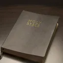A Bible laying on a table.