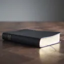 Bible laying on top of a table