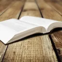 A Bible laying on a table.