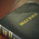 A Bible laying on a table.