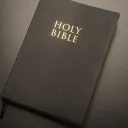 A Bible laying on a table.
