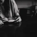A young woman reading a Bible.