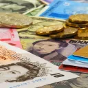 Money bills, coins and credit cards.