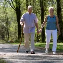 An elderly couple walking together.