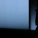 A silhouette of a person walking.