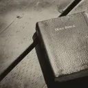 Bible laying on top of a table