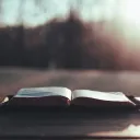 An open Bible on a table.