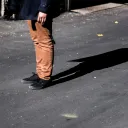 Shadow of a person's legs.