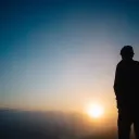 A person watching a sunset.