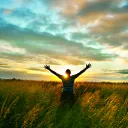 A person raising their hands to the sky.