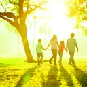 A family walking together outside.