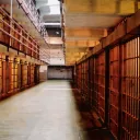 The hallway inside of a prison.