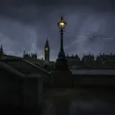 A night shot of London with Big Ben belltower in the distance.