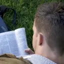 A man reading a Bible.