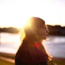 A woman with the sun reflecting through her hair.