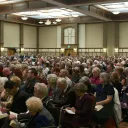 Church members listening to message delivered during the Feast.