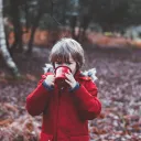 A little boy from a camp mug.