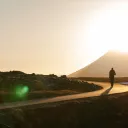 A person walking on a winding road.