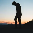 A silhouette of young man.