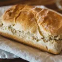 A loaf of bread on a cloth napkin.