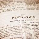 A Bible opened to the book of Revelation.