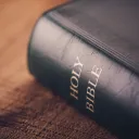 A Bible laying on a table.