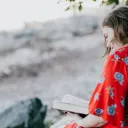 A woman reading a Bible.