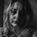 A woman crying photographed in grayscale