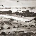 With the Normandy beachhead secured, vast numbers of Allied troops and military vehicles flood ashore.
