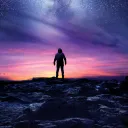 Silhouette of a man looking at the night sky filled with stars.