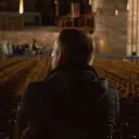 A man sitting in a church.