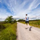 Man running on road.