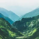 Photo of valley surrounded by mountains.