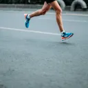 You Can Be a Successful Runner, a cropped image of a man's legs running on pavement