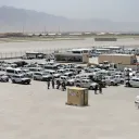 Afghan soldiers inspect some of the thousands of U.S. vehicles abandoned in the American pullout from Bagram Air Base, Afghanistan, in July 2021.