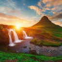 A gorgeous landscape photo of Kirkjufell in Iceland at sunset.