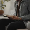 A man looking at a Bible.