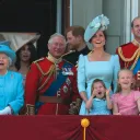 Four generations of Britain’s royal family watch a military flyover at Buckingham Palace.