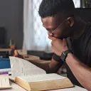 a man reading a Bible