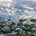 a surface of gray stones slightly covered with water