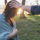 A photo illustration of the laying on of hands after a water baptism.