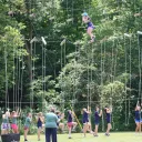 campers using a high ropes course outside