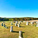 a cemetary filled with to,bstones