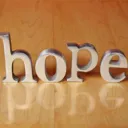 The letter HOPE on a table.
