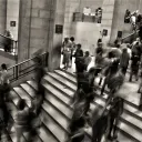A blur of people walking in a building.
