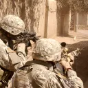 United States troops aiming guns.
