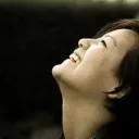 A woman looking up into the sky.