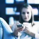 BUSY - a woman holding a TV remote