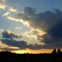 Sunset behind the clouds.